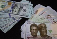 Naira crashes further, trades at N1,421/$1 at official window