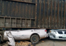Eight children escape death as container falls on 2 cars in Kogi