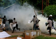 Breaking: Chaos in Lagos: Police Fire Tear Gas at Makoko Residents Demonstrating at State Assembly